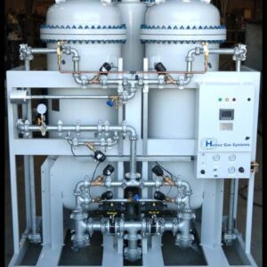 Niagara™ Series: industrial gas system with dual large vessels, control panel, gauges, valves, and connected piping.