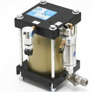 Drain-All Corrosion Handler® with metal fittings, pressure gauge, and a cylindrical filter chamber on a black base.