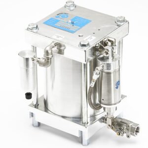 Drain-All Temperature Handler® with attached pipes, valves, and a blue identification label on top.