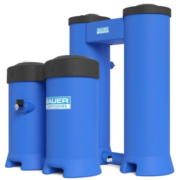Four large blue WOS SERIES Water-Oil Separator tanks by Bauer Compressors with black lids are side by side.